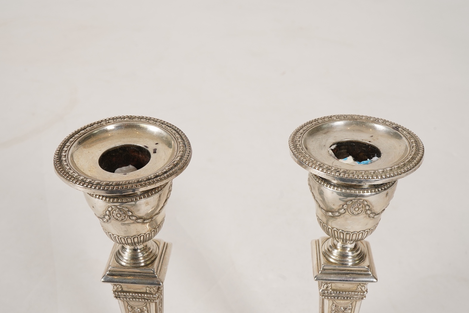 A pair of Victorian silver candlesticks, with fixed sconces, by Henry Wilkinson & Co